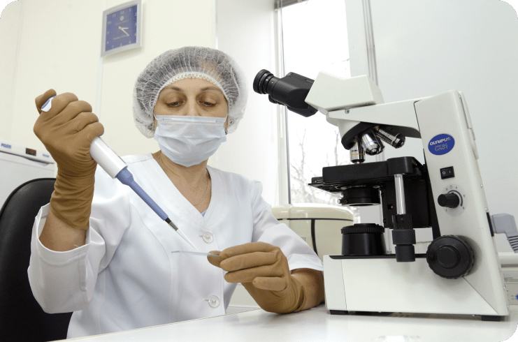 a scientist conducting in-vitro fertilization procedure