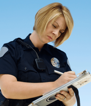 a policewoman filling a form for traffic offence